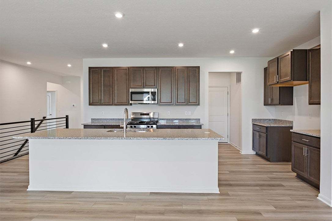 A contemporary kitchen features an inviting island