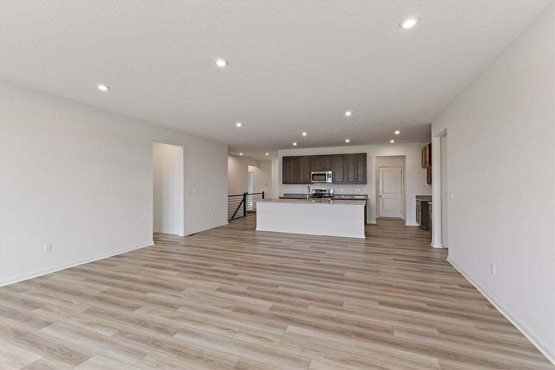 An open-concept living area boasts abundant recess