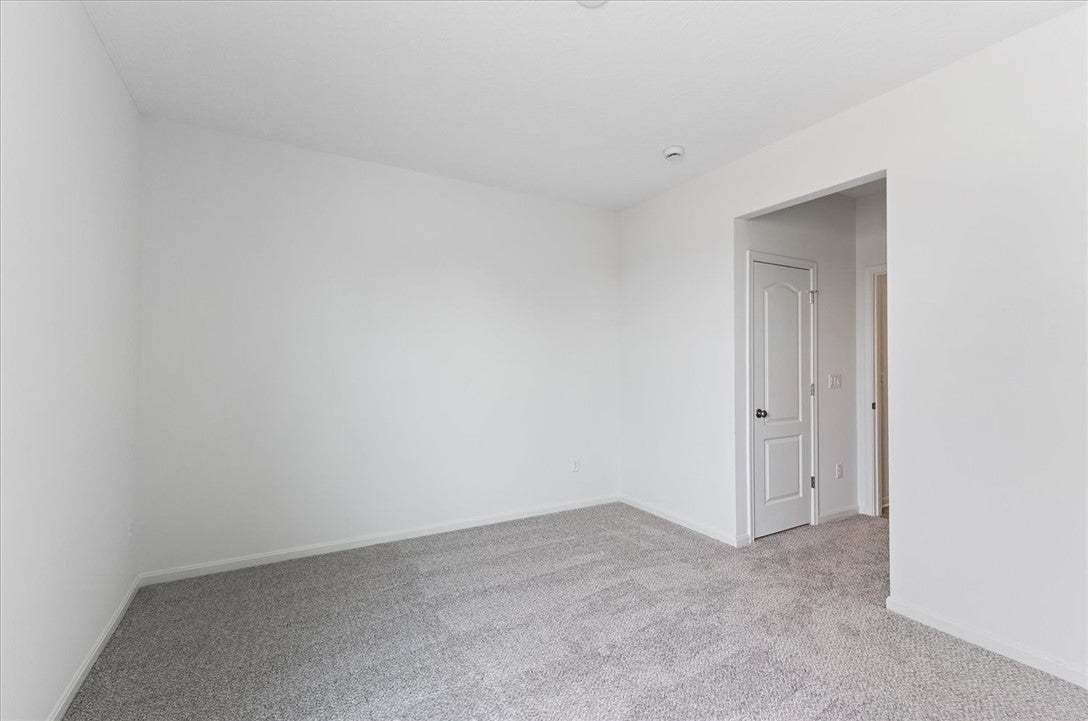 Newly installed, soft gray carpeting creates a cle
