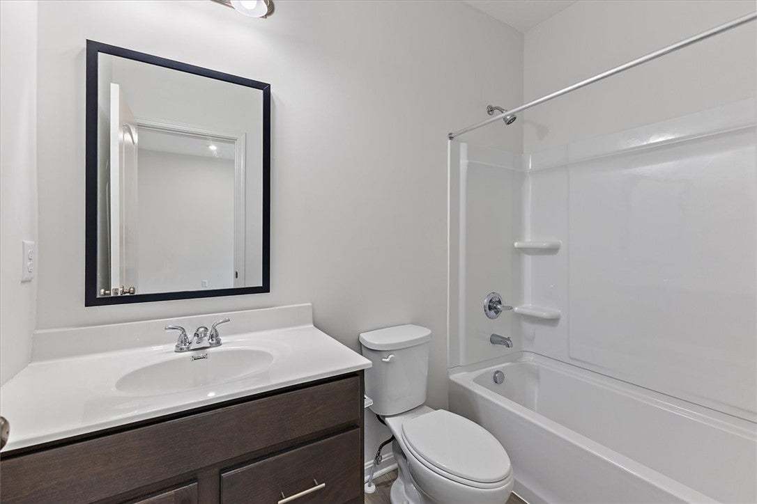 A well-appointed bathroom features a single vanity