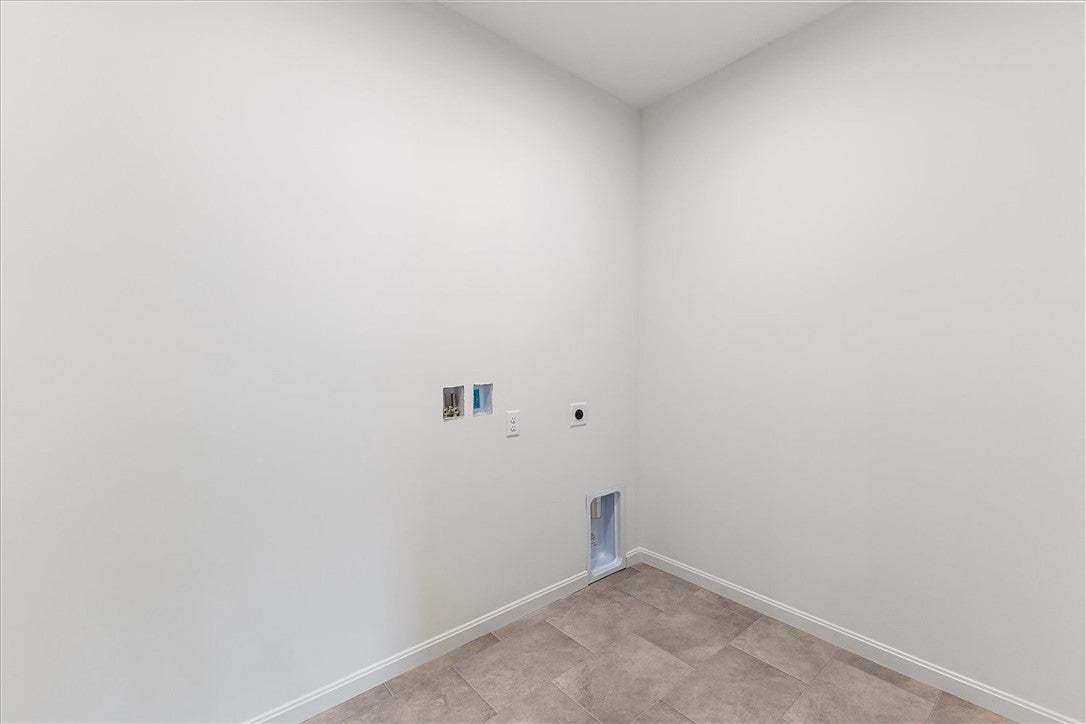 A dedicated laundry space featuring convenient was