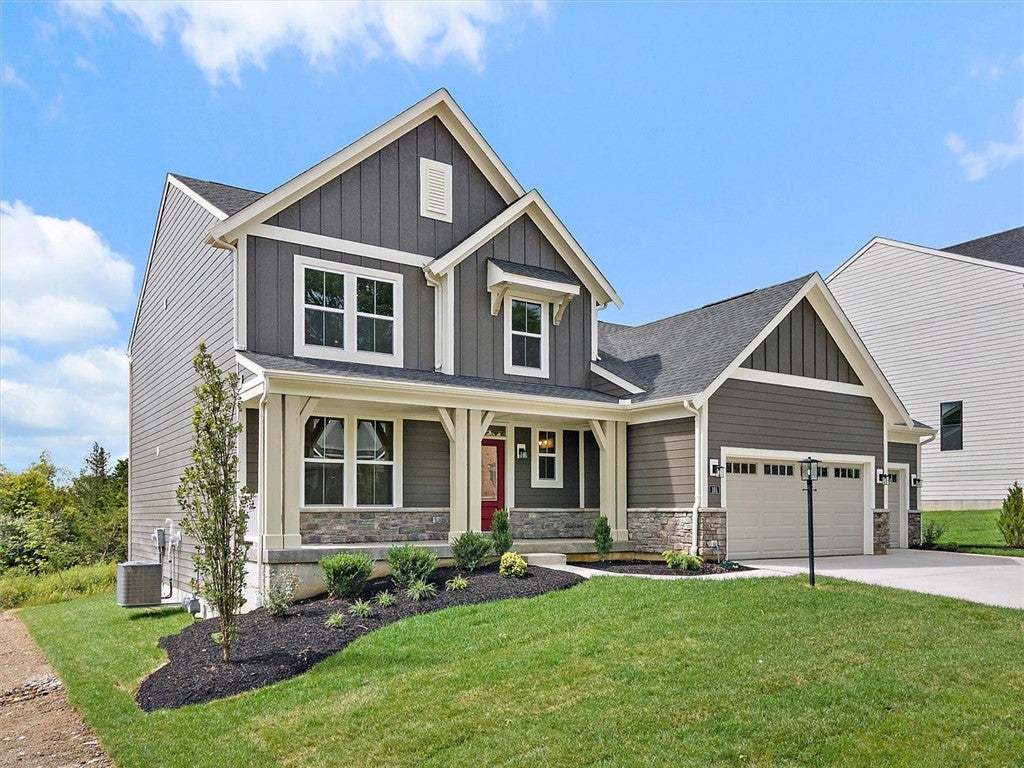 Board and batten siding pairs with stone accents t