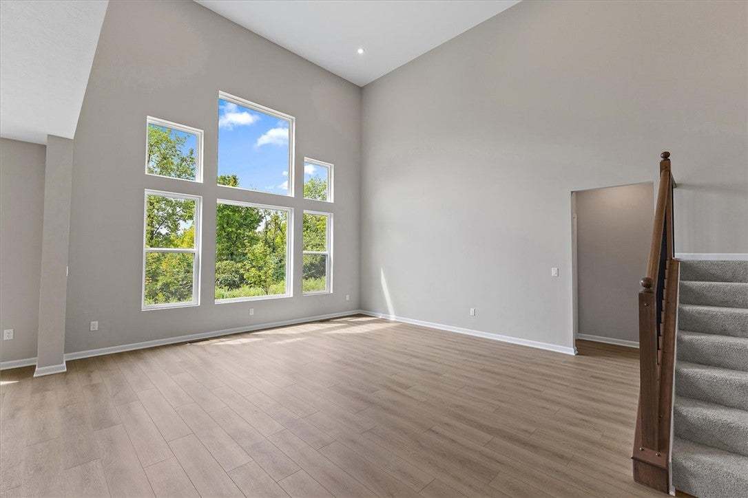 High ceilings and a wall of windows define this li