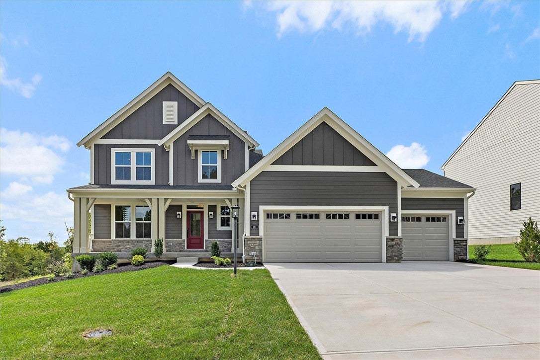 An inviting front porch and stone accents highligh