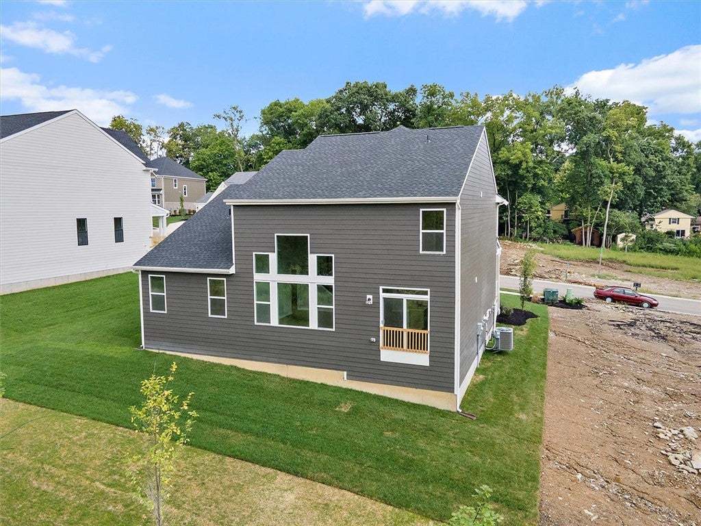 Modern siding and architectural windows define the