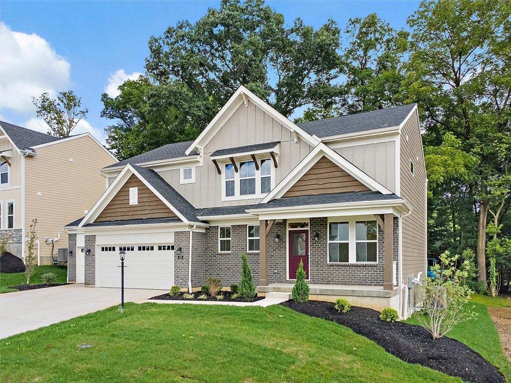 A classic front porch welcomes visitors to this me