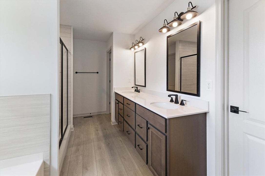 Clean lines and a double vanity define this contem