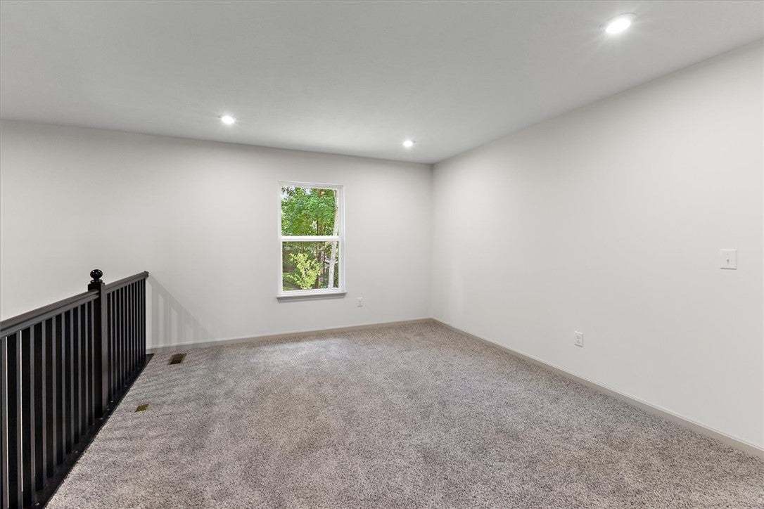 Plush carpet and recessed lighting define this ver