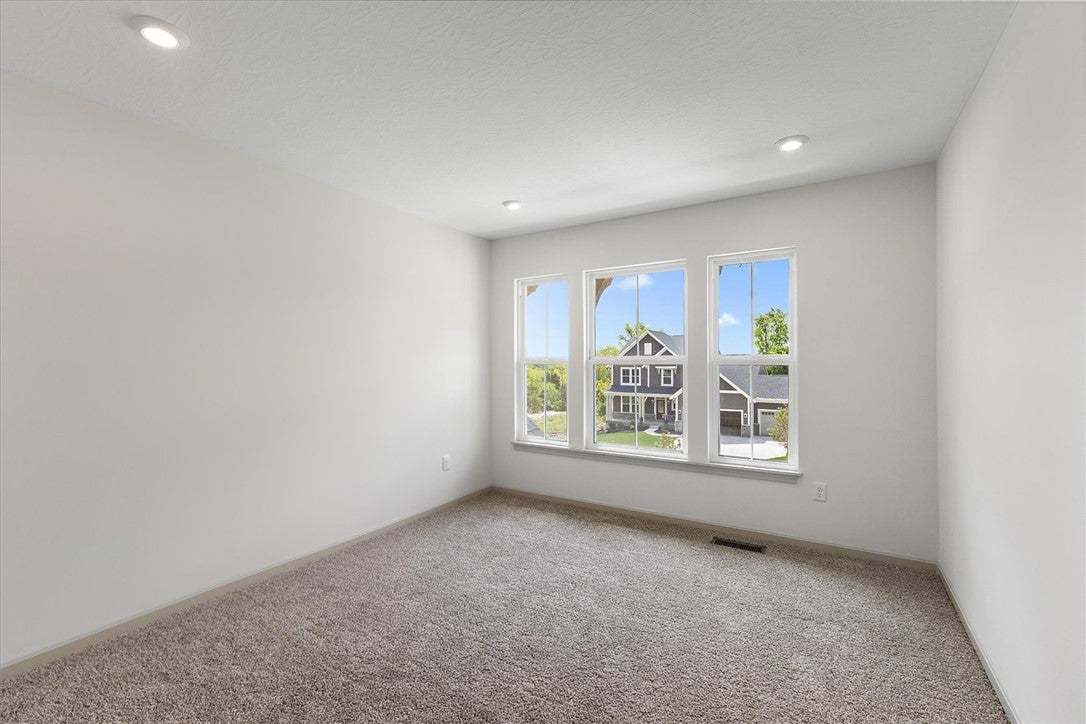 Plush carpeting and recessed lighting define this