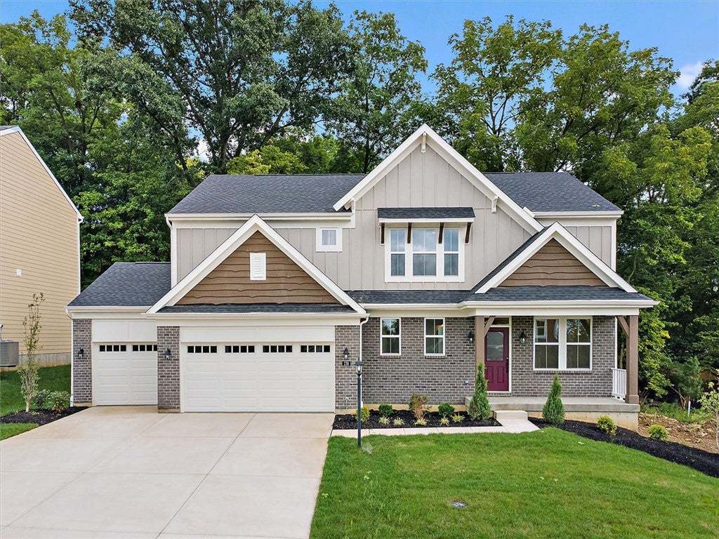 A classic brick and siding exterior stands against