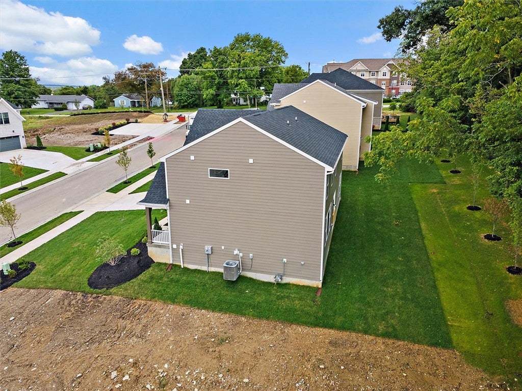 Green lawns border this multi-level home featuring