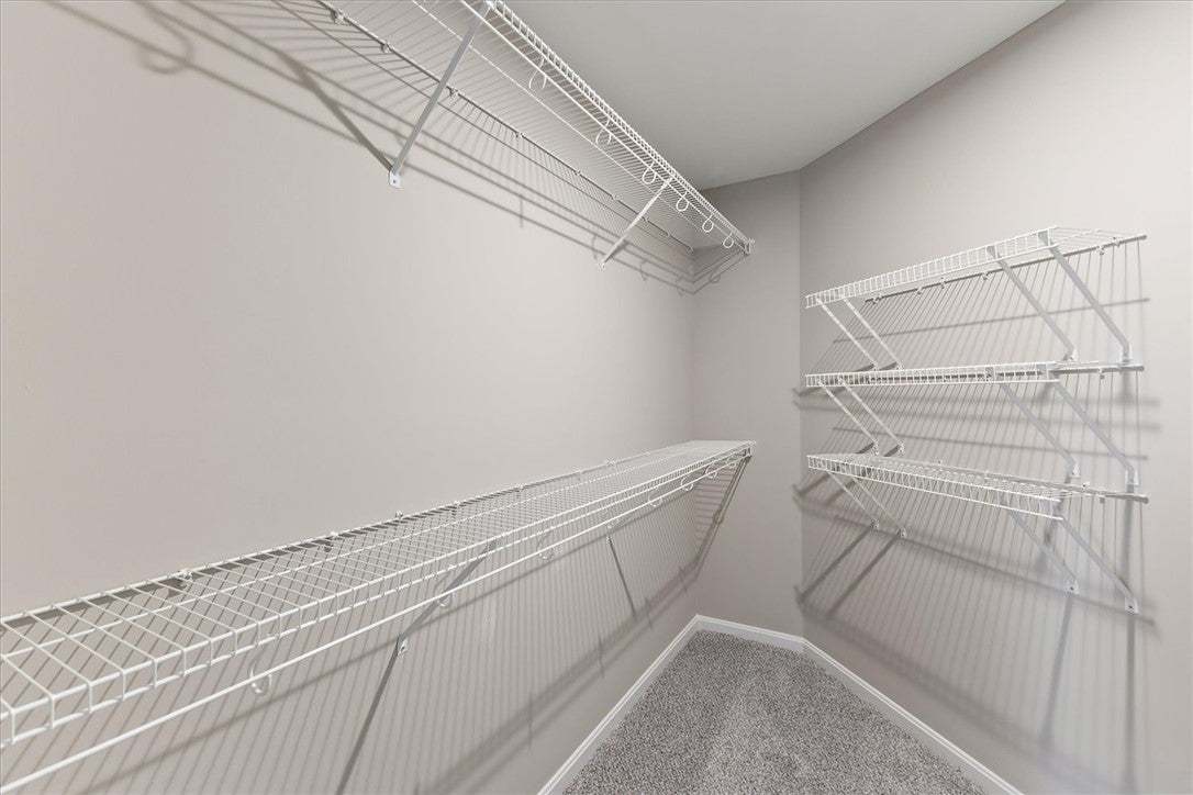Ample wire shelving lines this functional walk-in