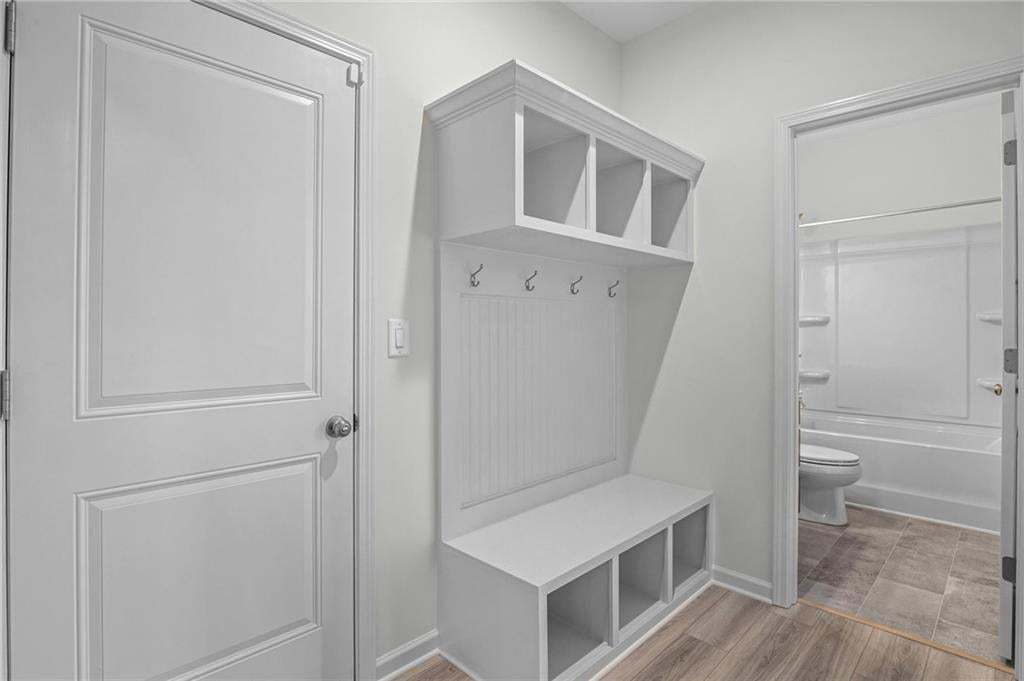 Built-in mudroom bench with cubby storage and coat hooks