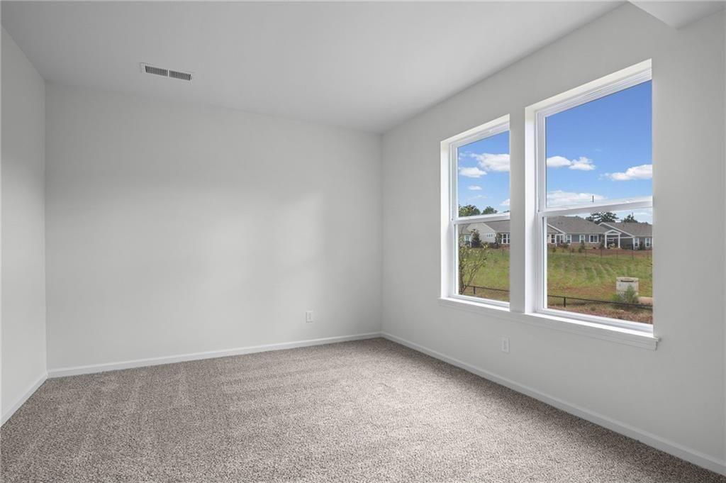 Bright room with two large windows offering abundant illumination
