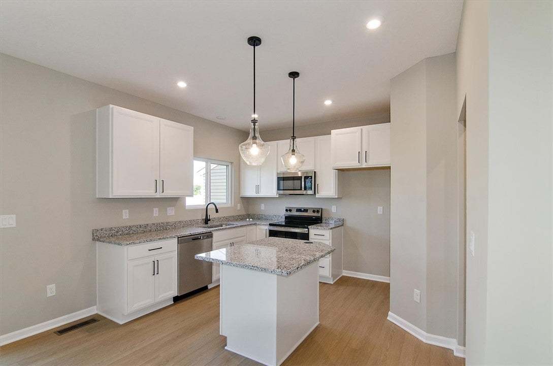 Polished stone countertops pair beautifully with c