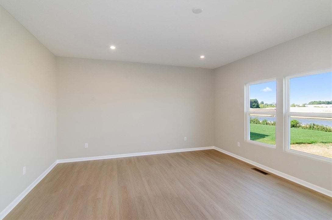 Smooth wood floors and large windows define this v