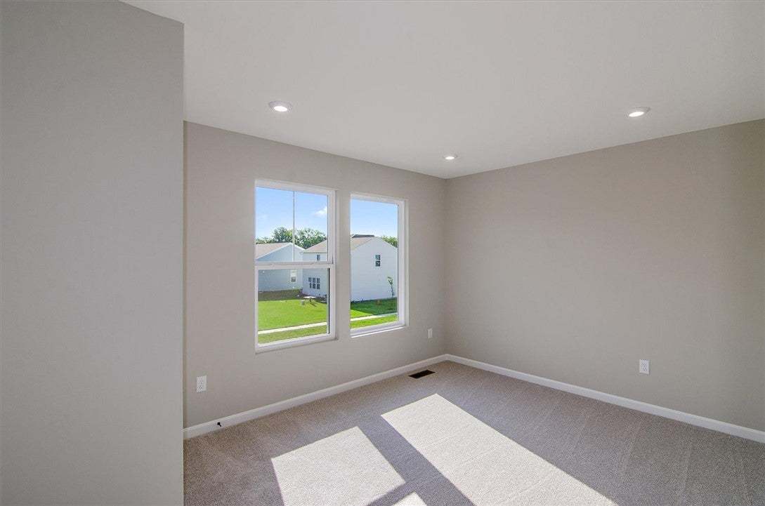 Recessed lighting and soft carpeting create a peac