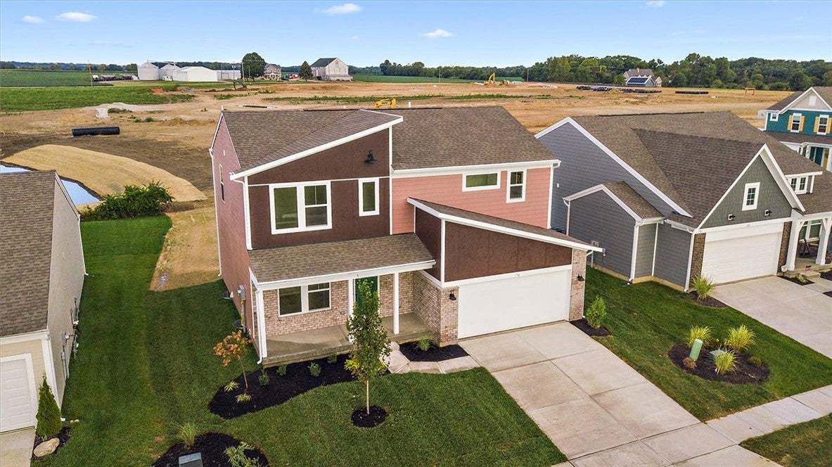 A striking modern exterior featuring mixed siding
