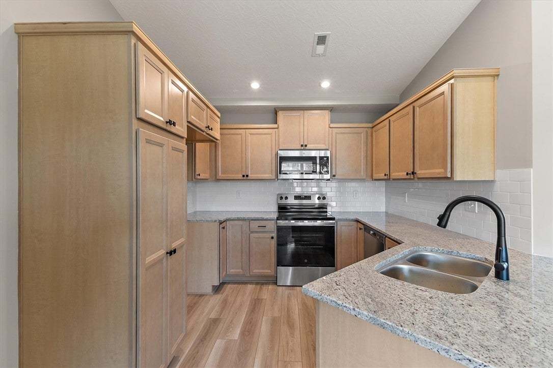 Gleaming granite countertops pair beautifully with