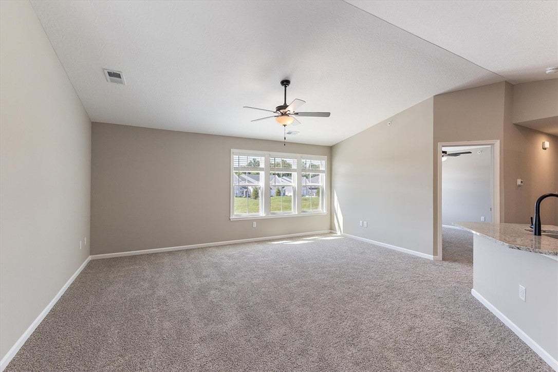 Vaulted ceilings and soft carpeting define this op