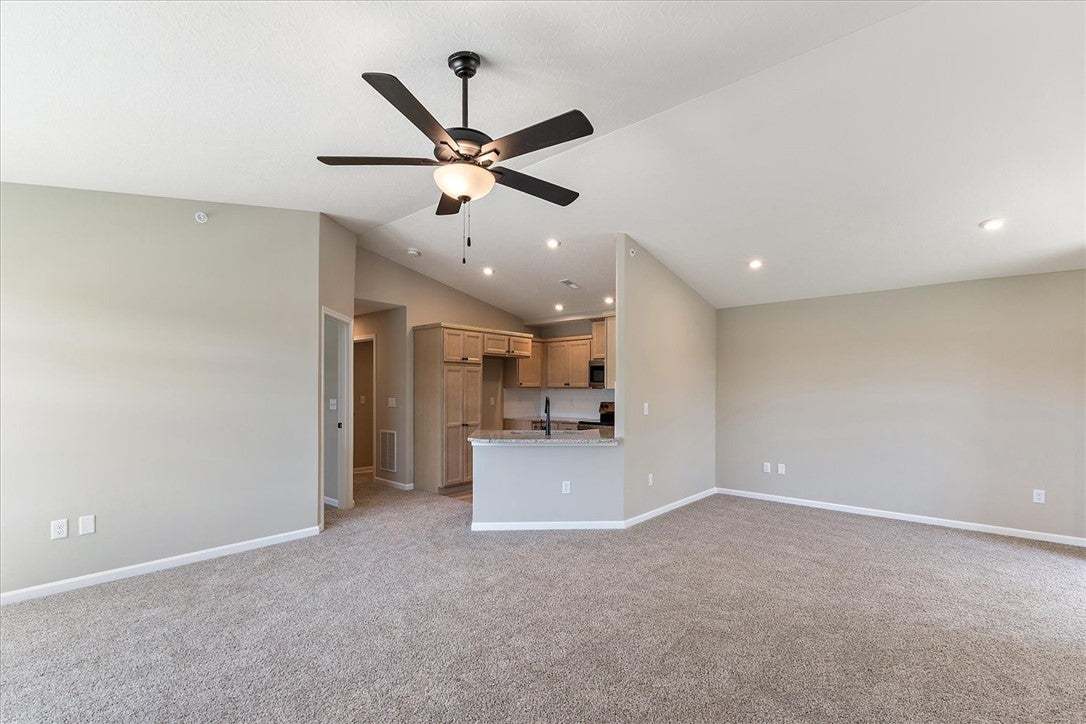 Vaulted ceilings and soft carpeting define this op