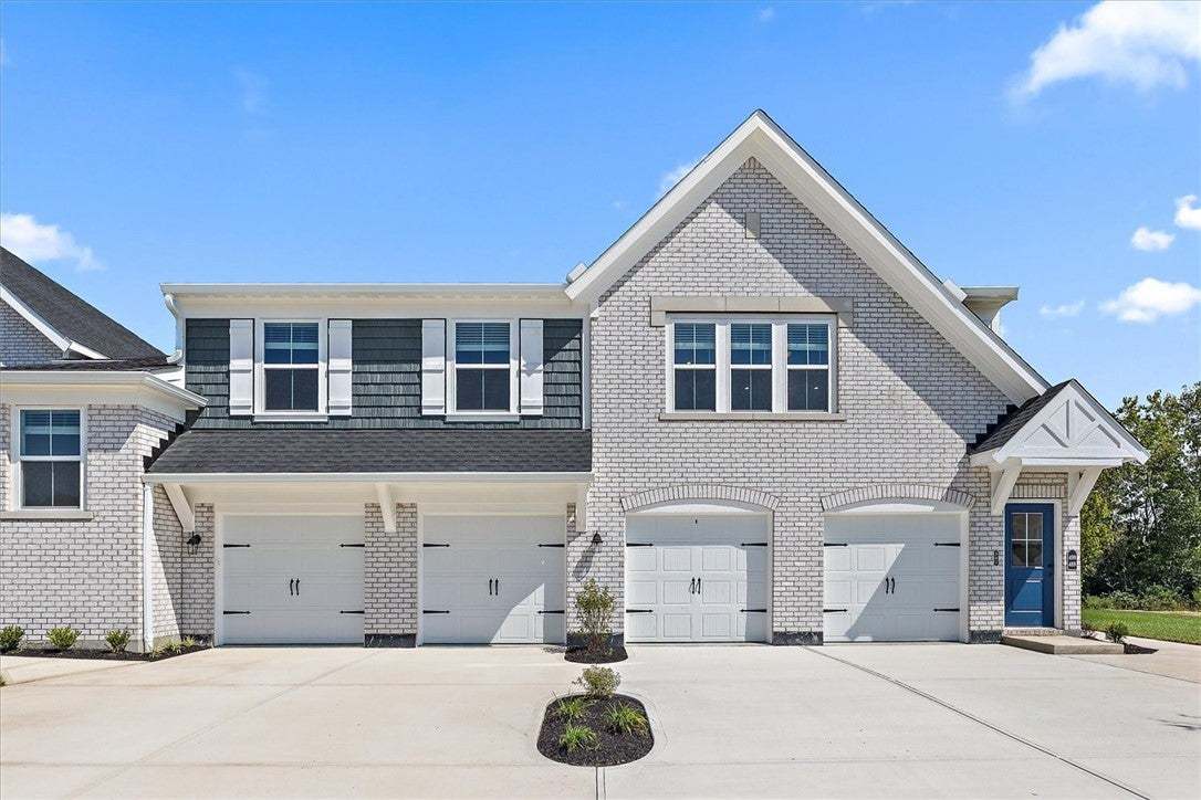 Gable rooflines and classic brick masonry define t