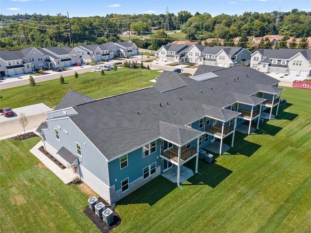 Neat lawns and modern siding define this contempor