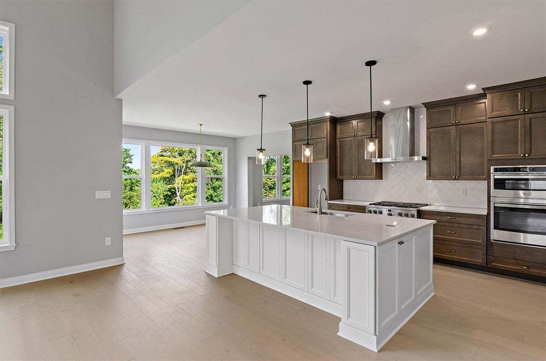 Clean lines and warm wood floors define this open