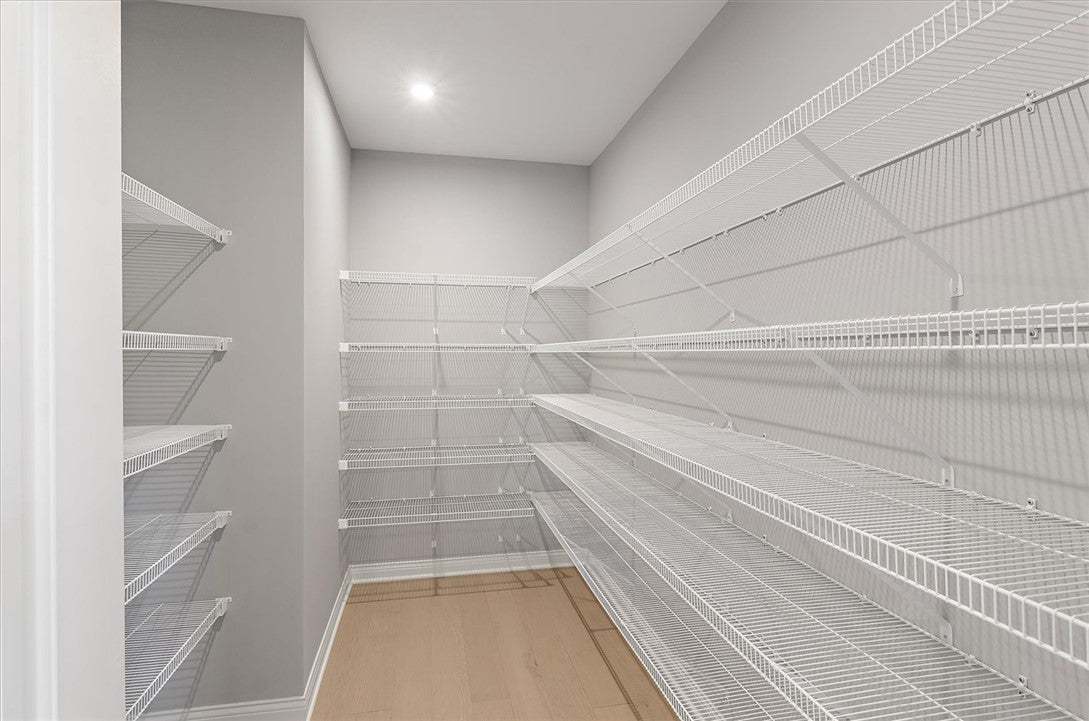 Ample built-in wire shelving lines this walk-in cl