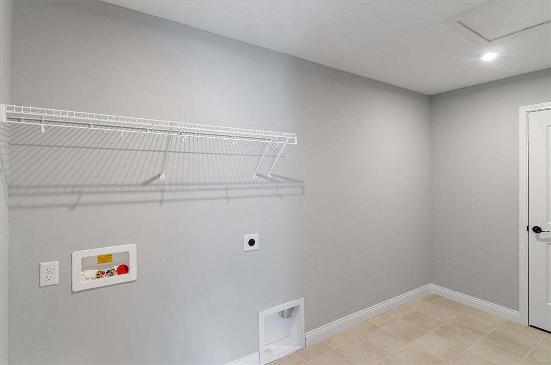 Tiled flooring and a wire storage shelf highlight