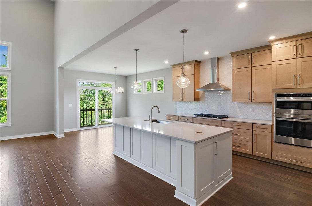 Hardwood floors and a central island anchor this o