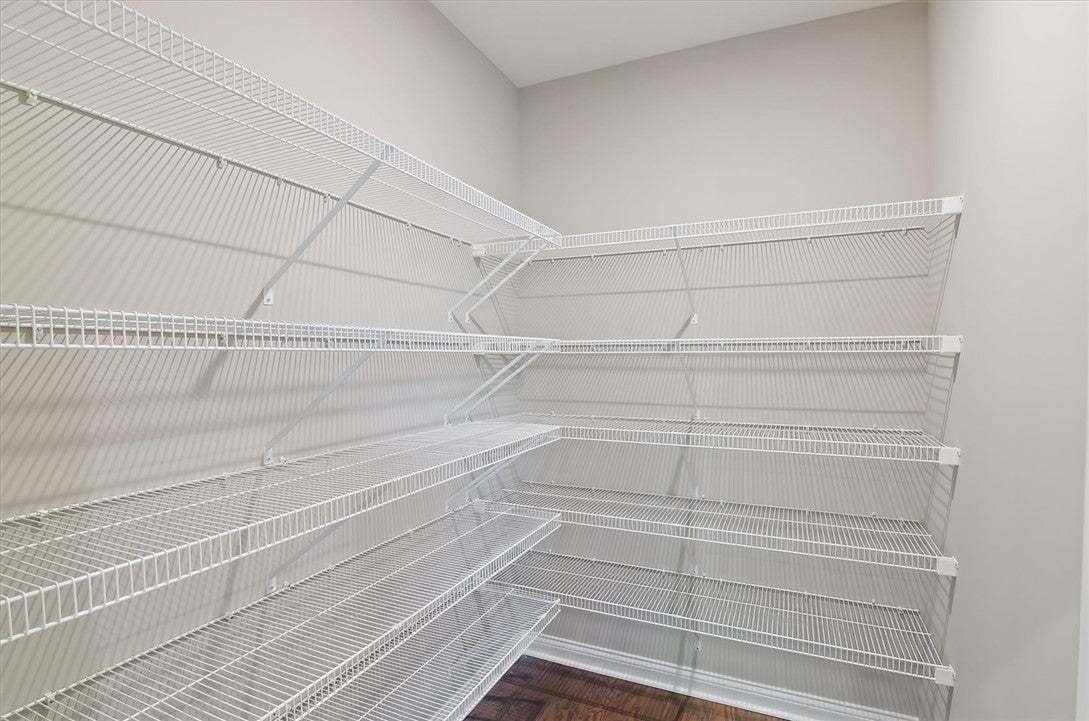 Ample built-in wire shelving units maximize storag