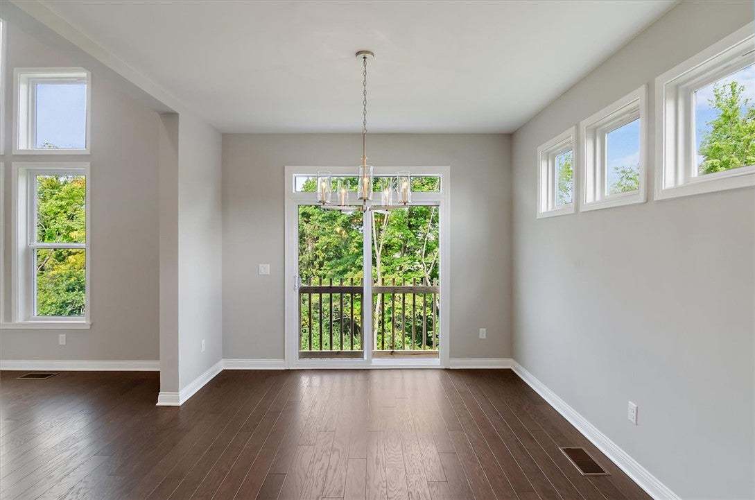 Gleaming hardwood floors and a modern light fixtur