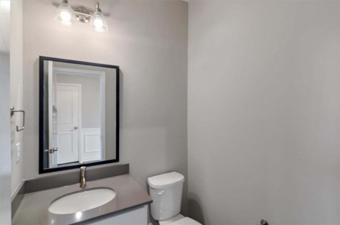 Clean lines and stone counters highlight this refi