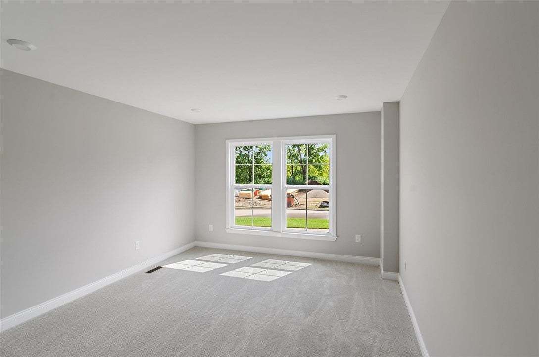Plentiful natural light streams across plush carpe