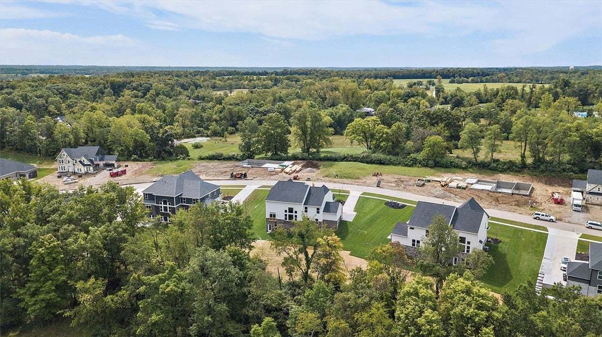 Lush woodlands encircle this developing residentia