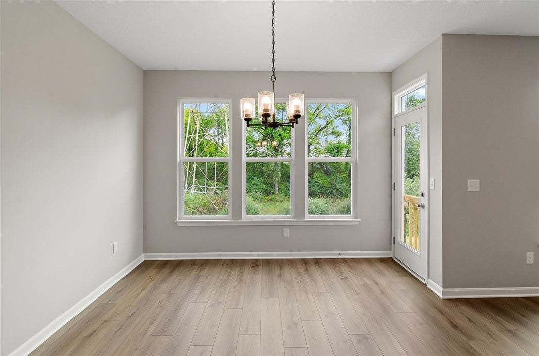 Gleaming hardwood floors and a classic chandelier