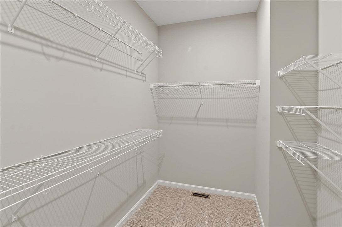 Ample wire shelving lines this functional walk-in