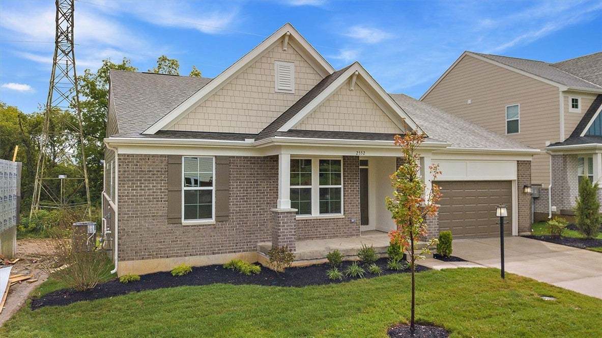 Charming brick and shake siding accents elevate th