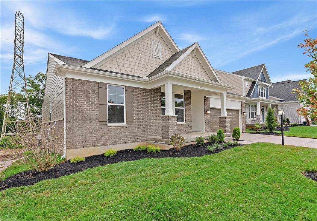 Classic brick and siding accents highlight the fro