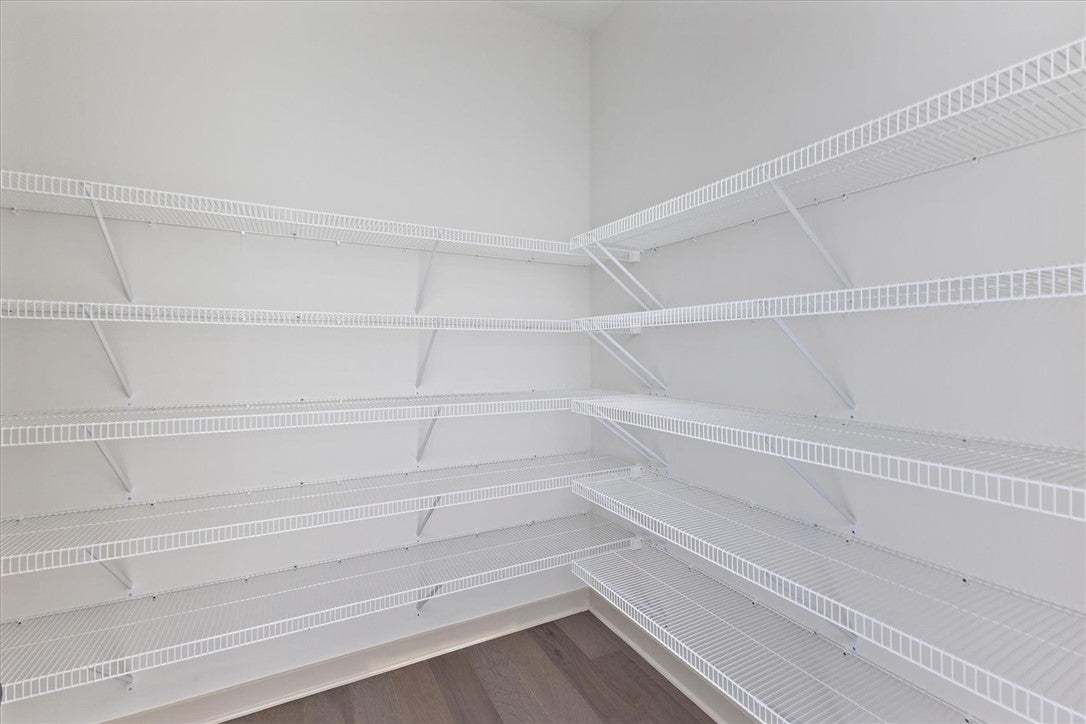 Ample built-in wire shelving optimizes storage spa