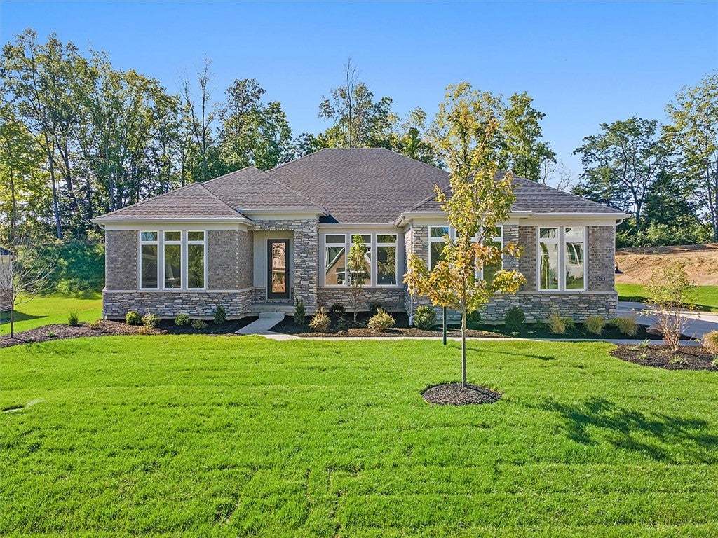 Fine stonework accents the exterior of this ranch-