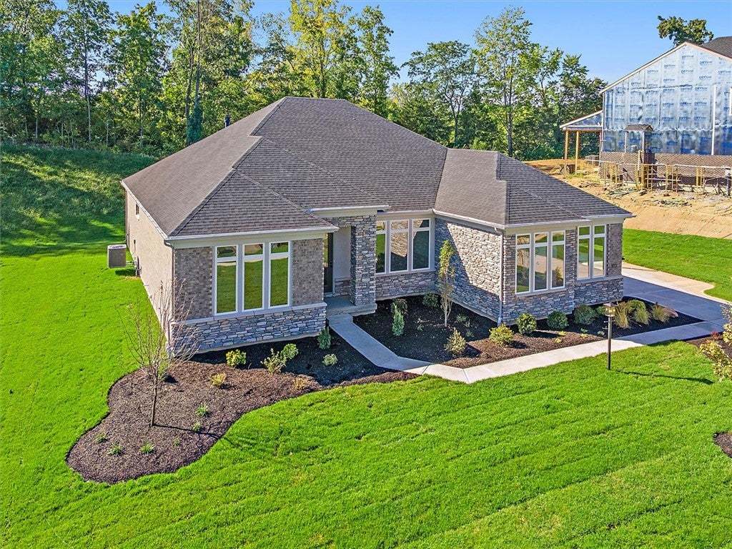 Crafted stone and brick facade accents this ranch-