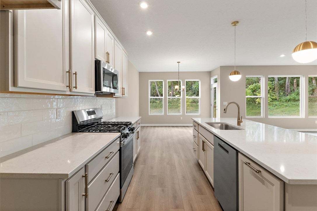 Gleaming stone countertops and modern cabinetry an