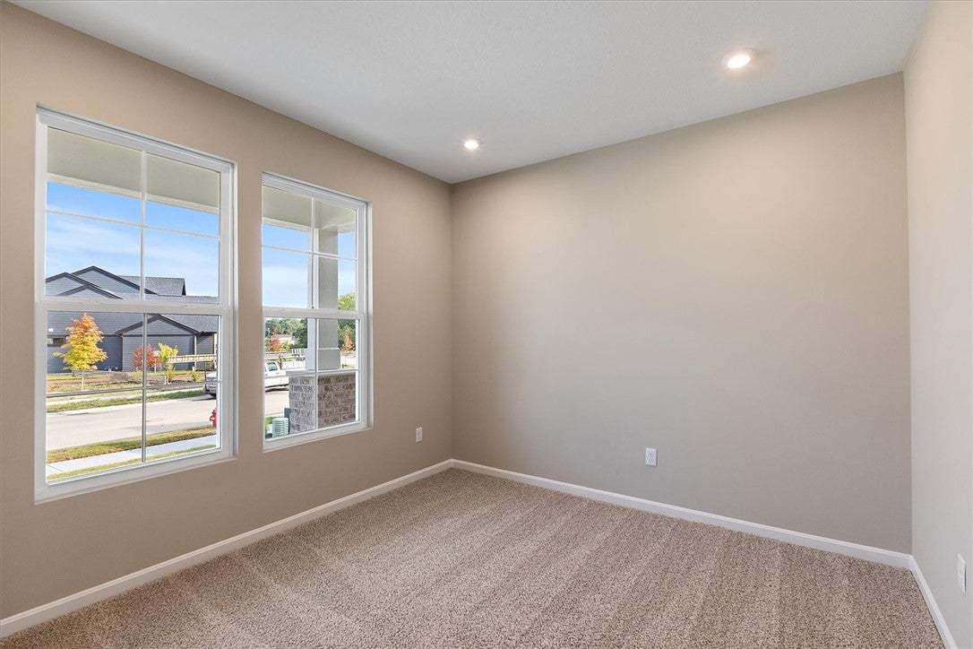 Natural light streams through large windows into t