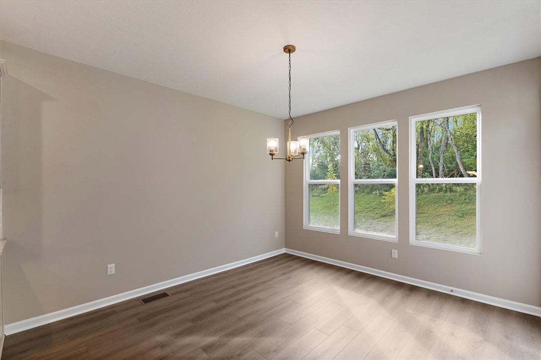 Large picture windows bring natural light and sere