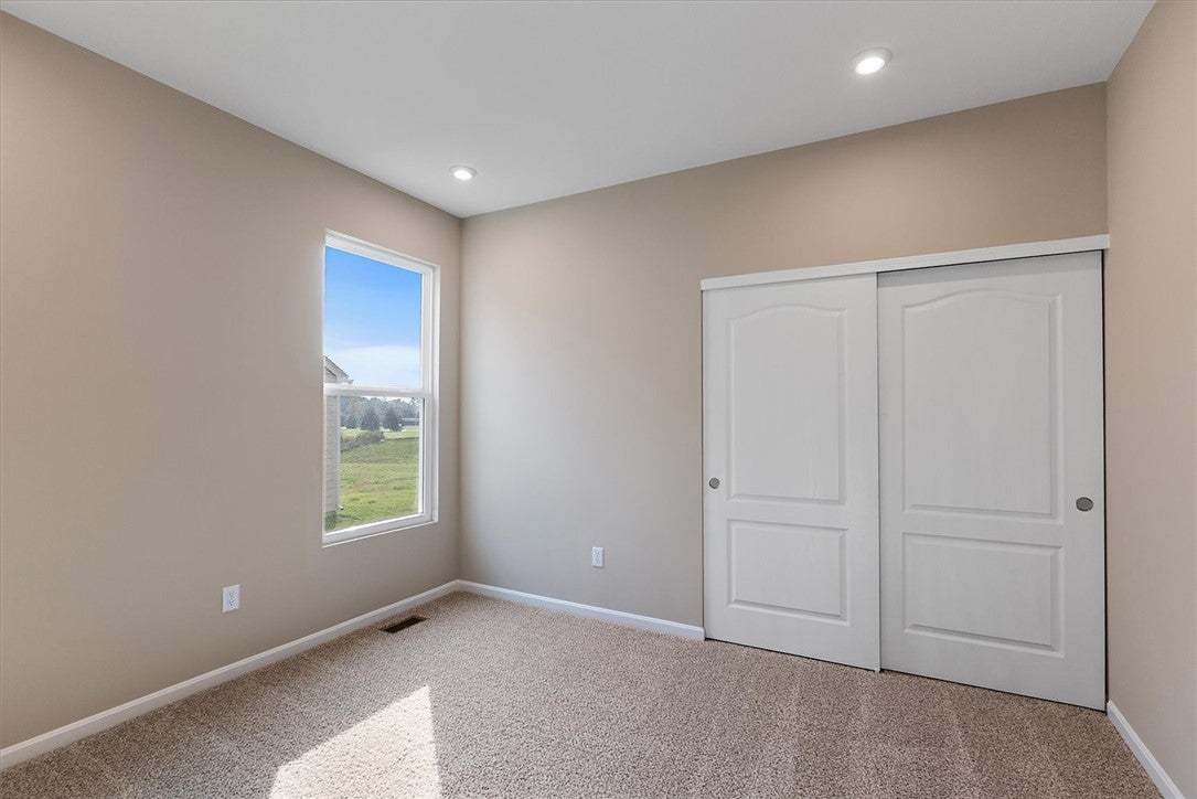 Recessed lighting and soft carpeting create a comf
