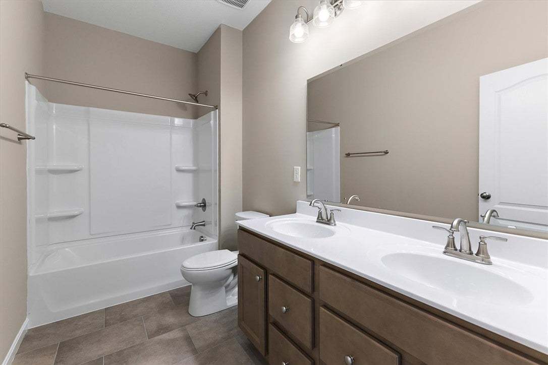 A spacious double vanity accents this modern bathr