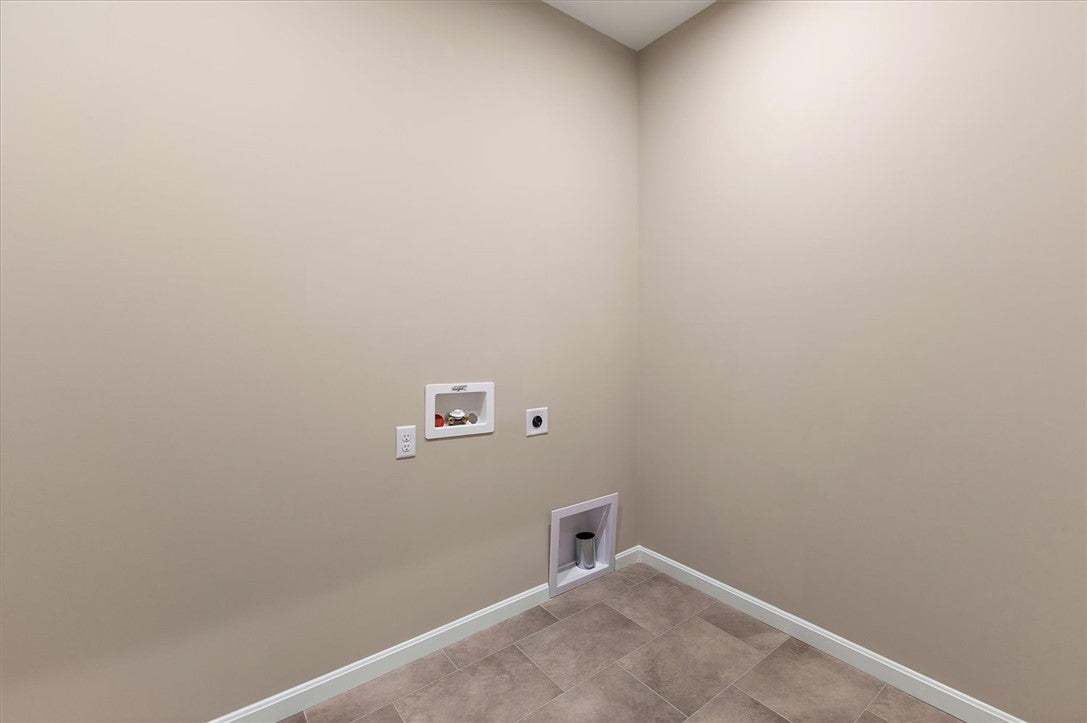A dedicated utility space features durable tile fl