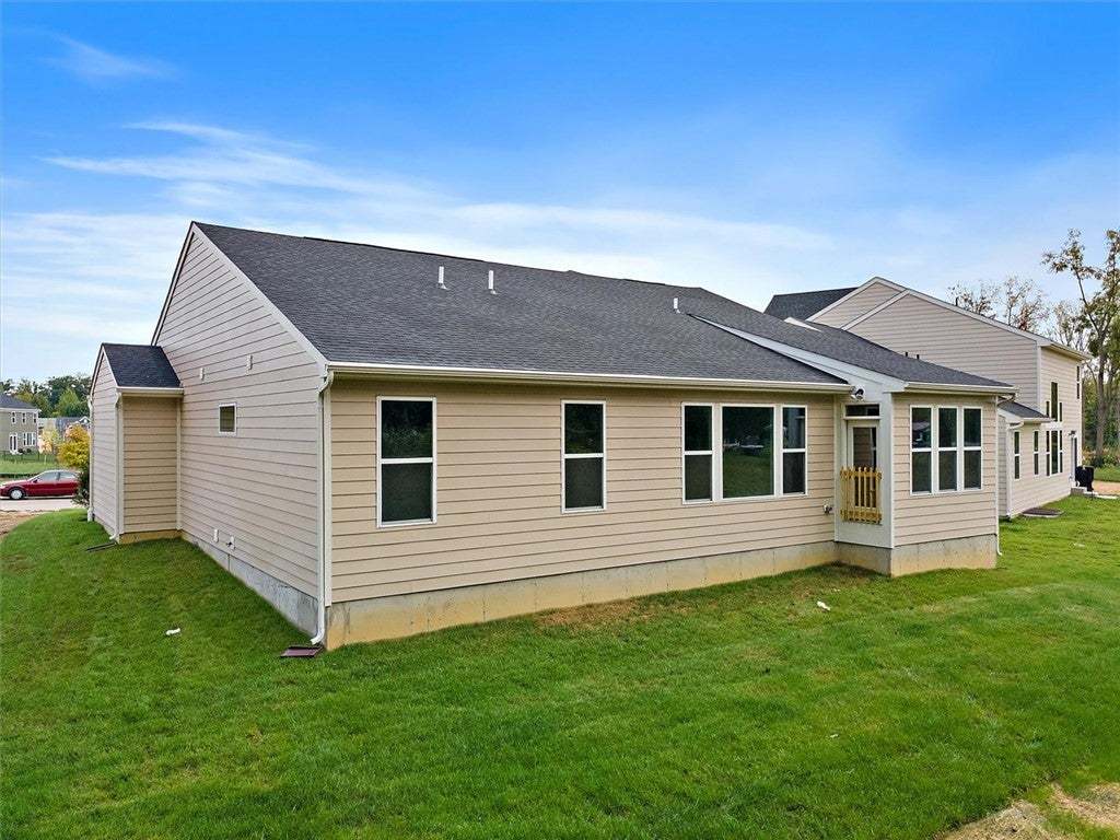 Neat siding and clean architectural lines define t